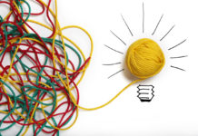 Yellow ball of wool with pen lines like lightbulb