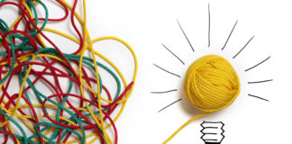 Yellow ball of wool with pen lines like lightbulb