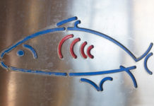 Fish icon on Metal Background