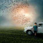 A Free World-Boy child holding bird cage freeing birds