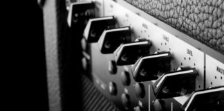 Detail of knobs on a guitar amplifier. AMP